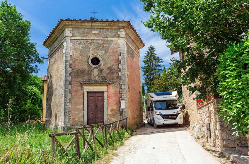 camper in a narrow alley