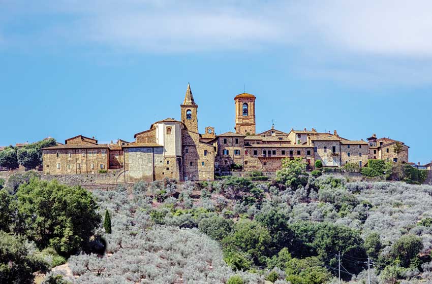Collemancio, a historic hamlet in Cannara, Umbria, showcases its medieval architecture against a backdrop of rolling hills and olive groves. Village Collemancio - Italian national heritage